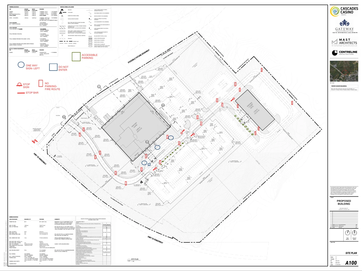 Parking-area site plan with accessible parking, directional signs, stop signs and fire-route signage marked